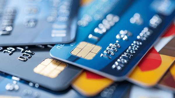 stack of credit card - judge rejects historic Visa, Mastercard settlement