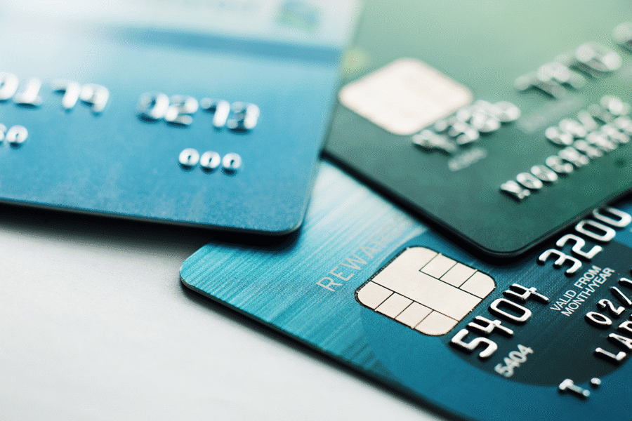 three debits cards on a desktop -featured image on IntelliPay 2025 debit guide