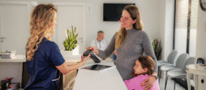 "Government office employee processing a digital payment to comply with paper check phase-out mandates.