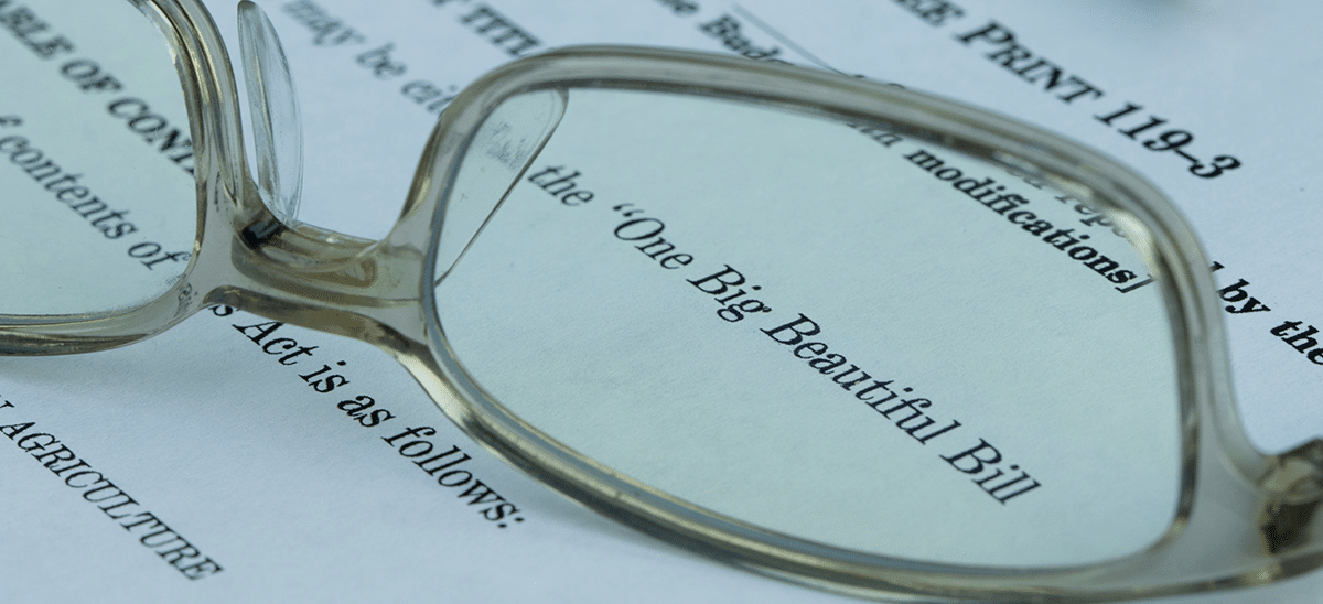glasses on big beautiful bill text for IntelliPay's article on effects of big beautiful bill on county treasurers