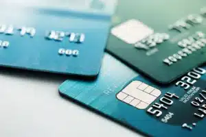 Close-up of overlapping debit and credit cards with visible security chips, representing essential payment tools for small business growth in 2025