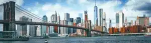 The new york compliance horizon mastering the fair business practices act of 2026 intellipay Wide-angle panorama of the New York City skyline and Brooklyn Bridge during a clear day, symbolizing the broad geographic and economic reach of the New York FAIR Act effective February 17, 2026.